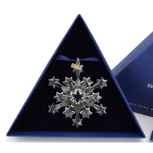 14 - Two Swarovski Crystal Christmas ornaments with boxes comprising dates 2004 and 2005