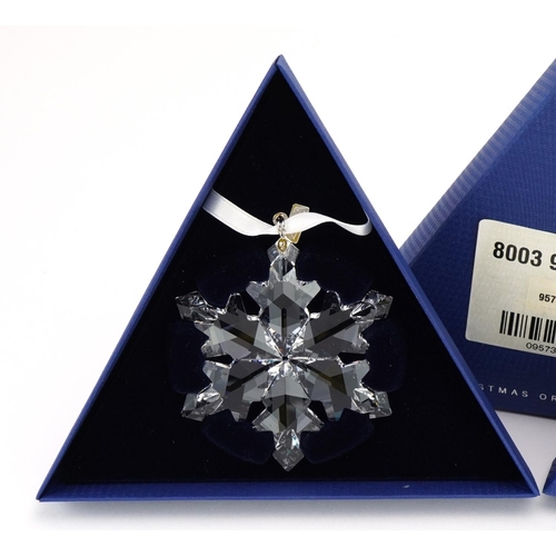 10 - Two Swarovski Crystal Christmas ornaments with boxes comprising dates 2012 and 2013
