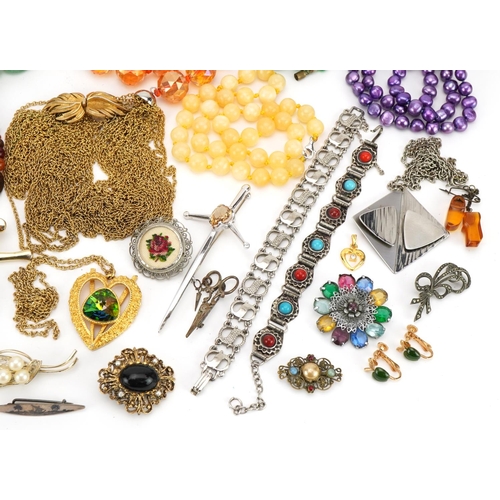 1619 - Vintage and later costume jewellery including a Trifari necklace, amber coloured bead necklaces, bro... 