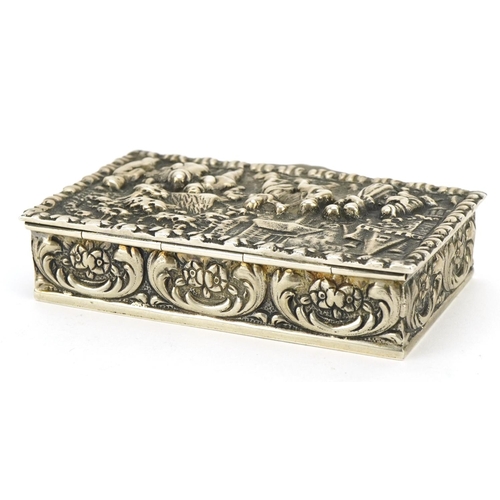 177 - Dutch silver snuff box, the hinged lid embossed with merry figures, impressed marks to the base, 8cm... 