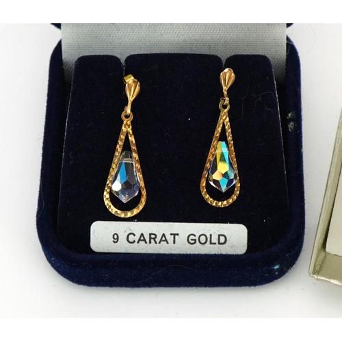 1499 - Two pairs of unmarked gold earrings comprising a pair of crystal drops and pair of dolphins, the lar... 