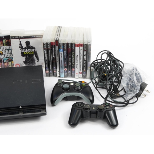 337 - PlayStation 3 games console with box and a collection of games