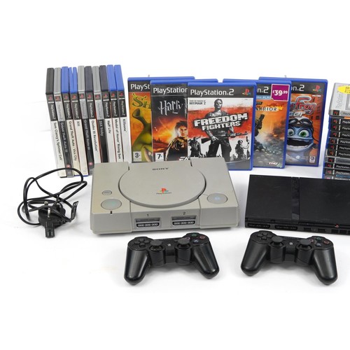 338 - PlayStation 1 and PlayStation 2 Slimline games consoles with controllers and a collection of games
