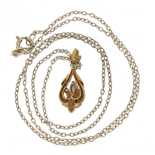 1502 - 9ct gold sapphire and diamond crossover drop pendant on a silver necklace, 2.2cm high and 50cm in le... 