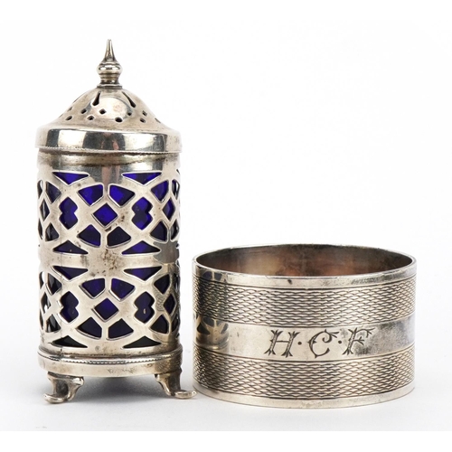 179 - Circular silver napkin ring with engine turned decoration and a silver caster with blue glass liner,... 