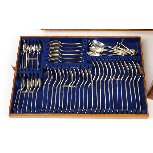 59 - Racine oak canteen of silver plated cutlery, the knives and carving set with ivorine handles, the ca... 