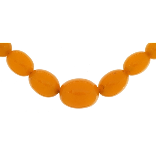 1562 - Amber coloured bead necklace, 54cm in length, 93.7g