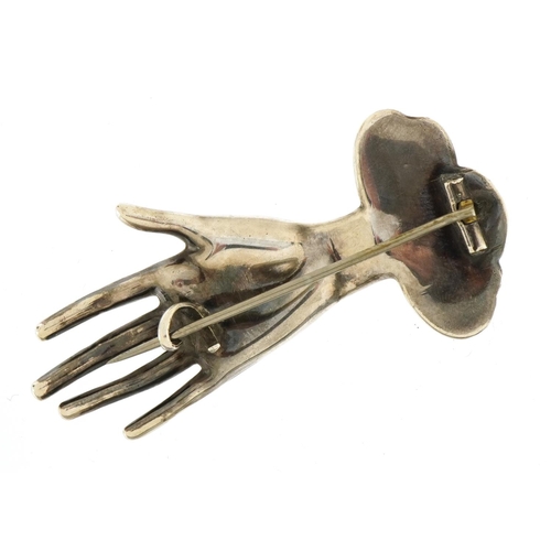 1542 - Unmarked silver brooch in the form of a female's hand, 6cm wide, 9.5g