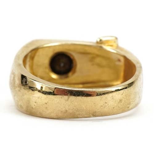 1033 - 9ct gold buckle ring set with a hematite, size S/T, 8.0g