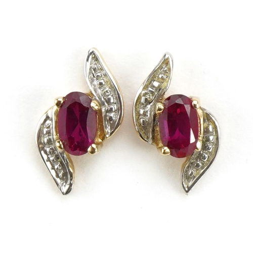 1113 - Pair of unmarked gold ruby and diamond crossover stud earrings, 1.2cm high, 0.9g