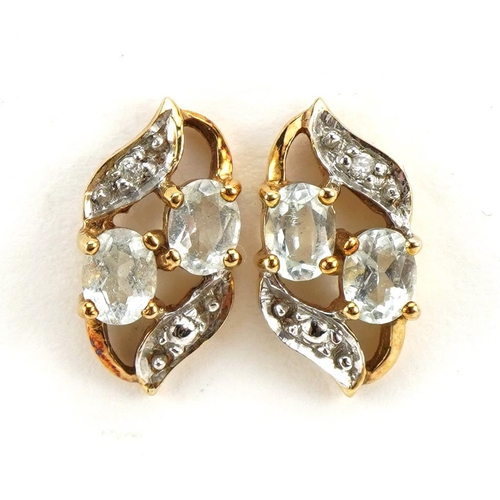 1090 - Pair of 9ct gold blue stone and diamond stud earrings, possibly aquamarine, 1.3cm high, 1.6g