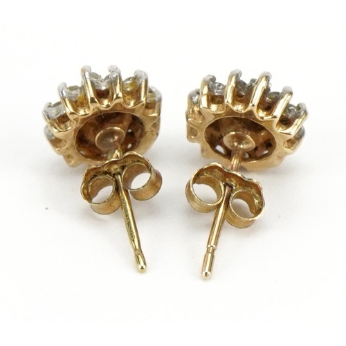 1094 - Pair of 9ct gold diamond three tier cluster stud earrings, 8mm in diameter, 1.3g