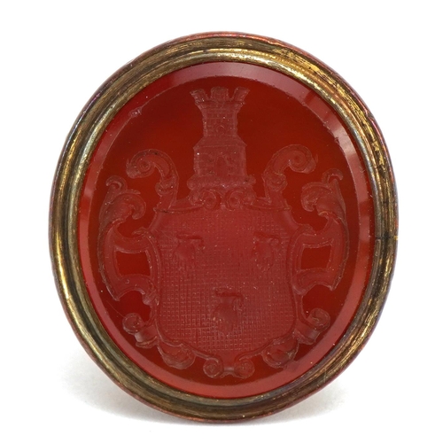 1594 - Two antique yellow metal carnelian seal fobs including one carved with a heraldic crest, the largest... 