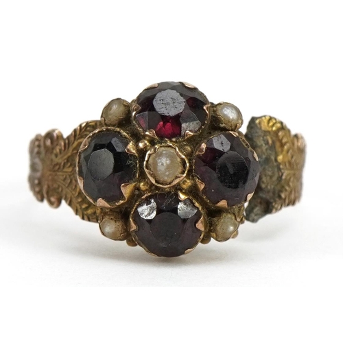 1523 - Victorian 9ct gold garnet and seed pearl cluster mourning ring with scrolled shoulders, Birmingham 1... 