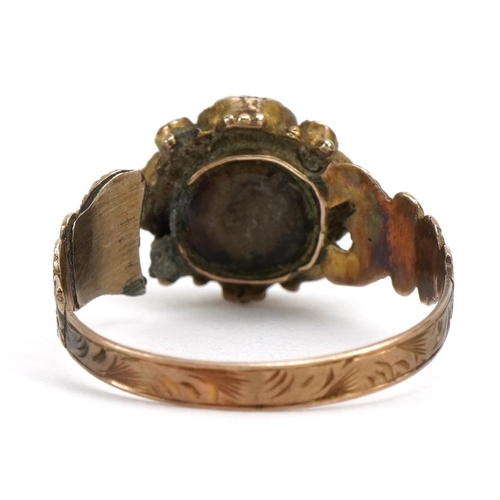 1523 - Victorian 9ct gold garnet and seed pearl cluster mourning ring with scrolled shoulders, Birmingham 1... 