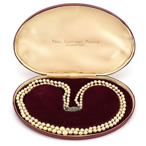 1576 - Graduated cultured pearl two string necklace with silver marcasite clasp and box, 44cm in length, 35... 