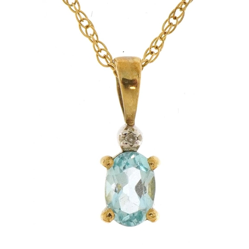 1545 - 9ct gold blue stone and diamond pendant on a 9ct gold necklace with matching earrings, the pendant 1... 