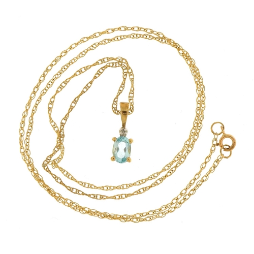 1545 - 9ct gold blue stone and diamond pendant on a 9ct gold necklace with matching earrings, the pendant 1... 