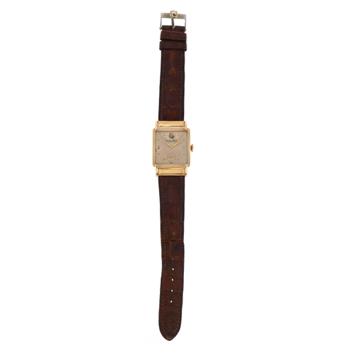 1105A - International Watch Co, gentlemen's 9ct gold wristwatch with Omega brown leather strap, the dial mar... 