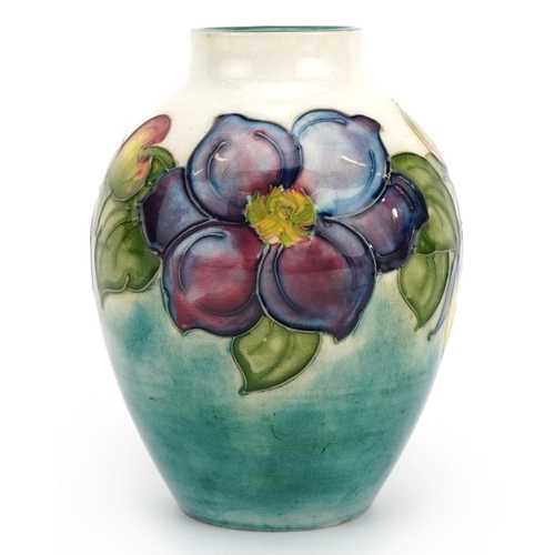 245 - Moorcroft Pottery vase hand painted with flowers, 12.5cm high