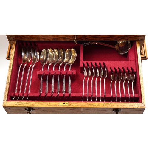38 - Lonsdale six place cutlery of silver plated cutlery housed in an Art Deco oak canteen with stand, 75... 