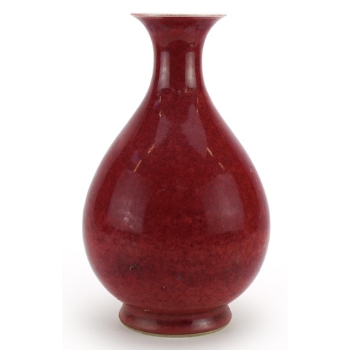 24 - Chinese porcelain vase having a sang de boeuf glaze, six figure character marks to the base, 31cm hi... 