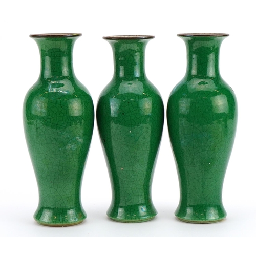 516 - Garniture of three Chinese porcelain baluster vases  having green crackle glazes, each 23cm high