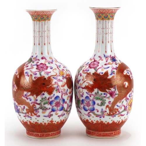 263 - Pair of Chinese porcelain vases hand painted in the famille rose palette and iron red with dragons c... 