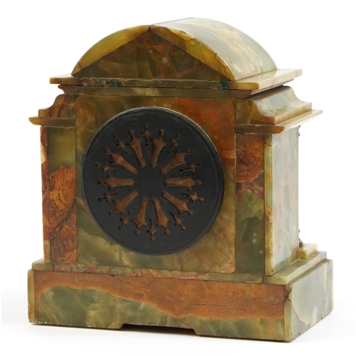 217 - Green onyx mantle clock with brass column supports and mounts, the enamelled chapter ring having Rom... 