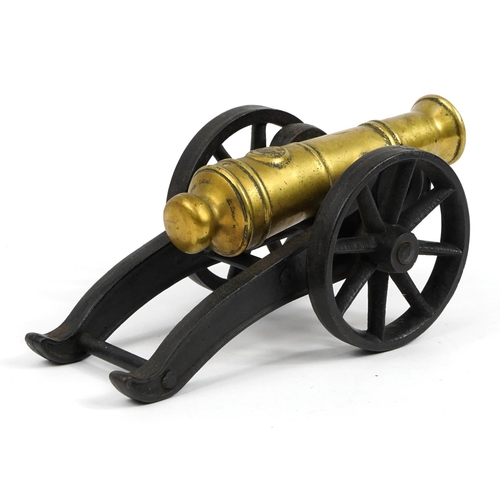 431 - Gilt bronze and cast iron model table cannon, 33cm in length