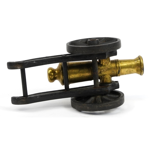 431 - Gilt bronze and cast iron model table cannon, 33cm in length