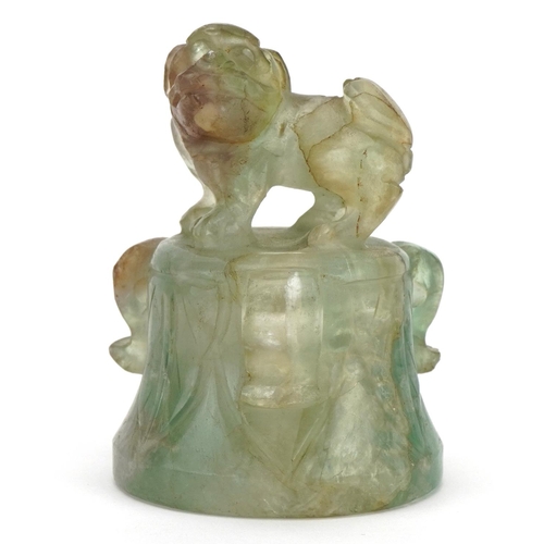 389 - Chinese fluorite carving of an Archaic style bell with foo dog knop, 7cm high