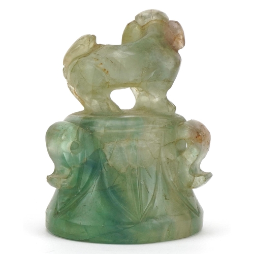 389 - Chinese fluorite carving of an Archaic style bell with foo dog knop, 7cm high