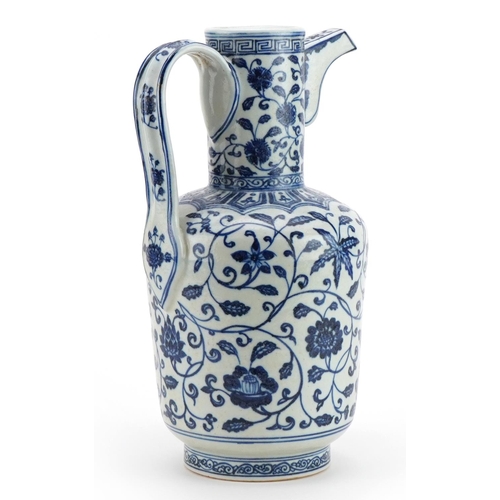 264 - Chinese Islamic blue and white porcelain water jug hand painted with flowers, 34cm high