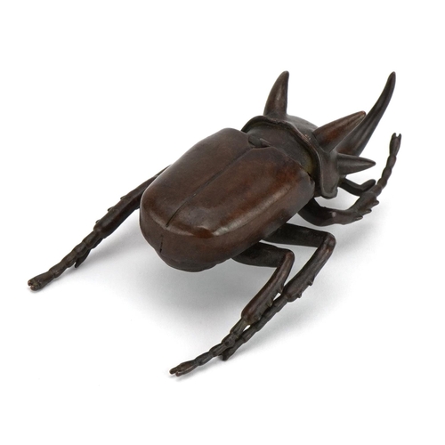 447 - Japanese patinated bronze rhinoceros beetle with hinged back 10.5cm in length