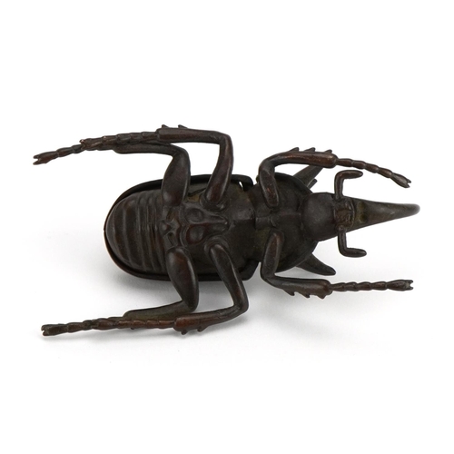 447 - Japanese patinated bronze rhinoceros beetle with hinged back 10.5cm in length