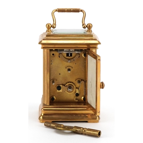 86 - Miniature brass cased carriage clock with swing handle and Sevres style panels, hand painted with ch... 