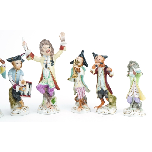 110 - Set of eight continental hand painted porcelain monkey band musicians, 15.5cm high