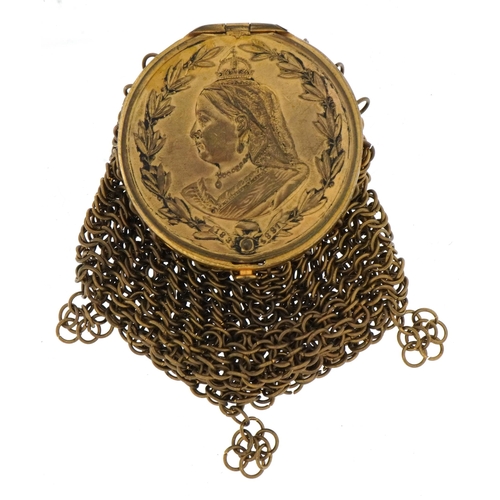 366 - Victorian brass miser's purse with a bust of Queen Victorian and sovereign holder, 9cm high