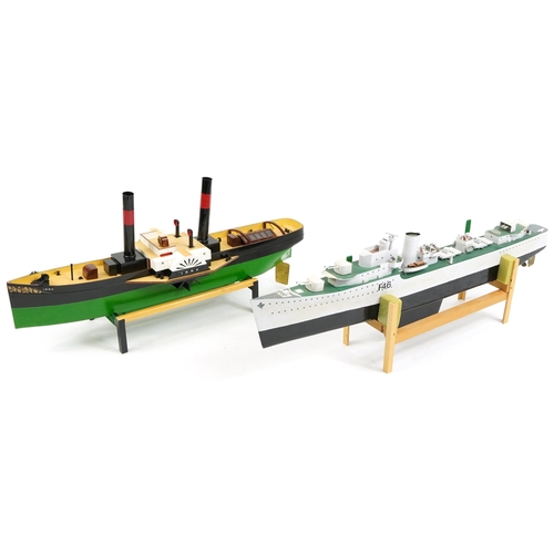 1459 - Two large hand painted model boats by John Evans raised on display stands, the largest 76cm in lengt... 