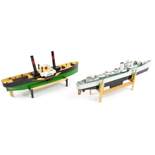 1459 - Two large hand painted model boats by John Evans raised on display stands, the largest 76cm in lengt... 