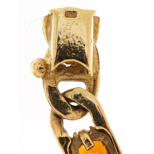2125 - 9ct gold curb link design bracelet set with purple, green and orange stones, 17.5cm in length, 12.4g