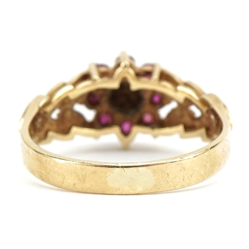 9ct gold ruby and diamond flower head ring, with leaf design shoulders