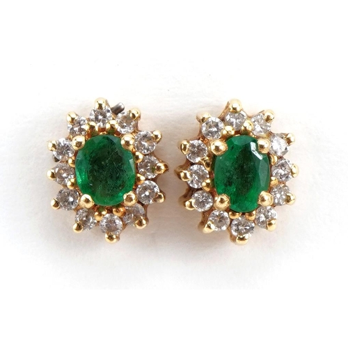 2121 - Pair of unmarked gold emerald and diamond cluster stud earrings, the backs marked 750, 8mm high, 2.5... 