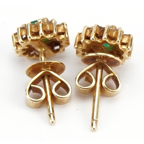 2121 - Pair of unmarked gold emerald and diamond cluster stud earrings, the backs marked 750, 8mm high, 2.5... 