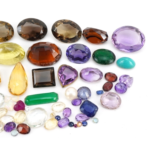 2619 - Collection of loose gemstones including amethyst, smoky quartz, citrine and opal love hearts, the la... 