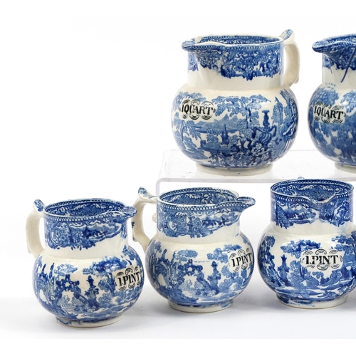 170 - Eight 19th century blue and white transfer printed pottery measuring jugs including one quart and on... 