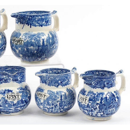 170 - Eight 19th century blue and white transfer printed pottery measuring jugs including one quart and on... 