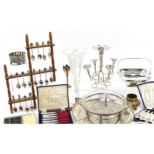 1233 - Silver plate including circular four footed salver, souvenir teaspoons on display stands, cruets, cu... 