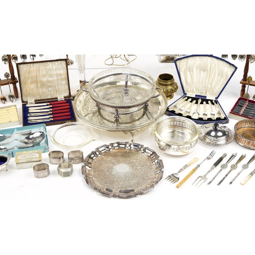 1233 - Silver plate including circular four footed salver, souvenir teaspoons on display stands, cruets, cu... 